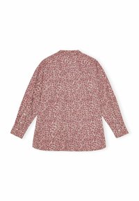 Camicia a maniche lunghe, base crema con un piccolo motivo floreale rosso. Tessuto morbido, vestibilità ampia, polsini con bottoni e colletto sul retro.