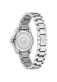 Sudraba nerūsējošā tērauda pulkstenis ar pulētu st bracelet un apaļu korpusu. Iespējas ietver safīra kristālu un gravētu aizmuguri ar logo un detaļām.