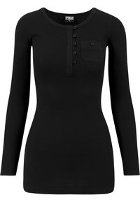 Haut noir à manches longues en rib avec un col rond, une patte de boutonnage et une poche sur la poitrine gauche. Le tissu est lisse et a une coupe ajustée.
