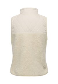 Beige ärmellose Weste mit einem gesteppte oberen Abschnitt und einem weichen, flauschigen unteren Abschnitt. Mit einem kleinen Logo-Button unten rechts.