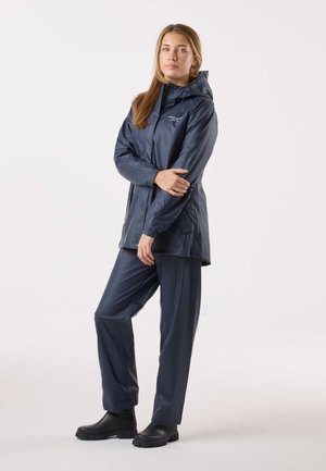 Navy waterproof jacket and pants, featuring a hood, front buttons, two side pockets, and black rubber boots. Smooth texture and modern design.