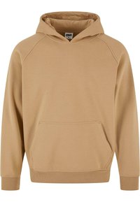 Beige hettegenser med en frontlomme av kenguru, teksturert stoff, raglanermer og ribbestrikkede mansjetter og hem.