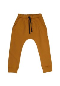 Senfgelbe Jogginghosen aus Baumwollmischung mit elastischem Bund, marineblauem Kordelzug und Seitentaschen. Eng zulaufende, umgekrempelte Beine.