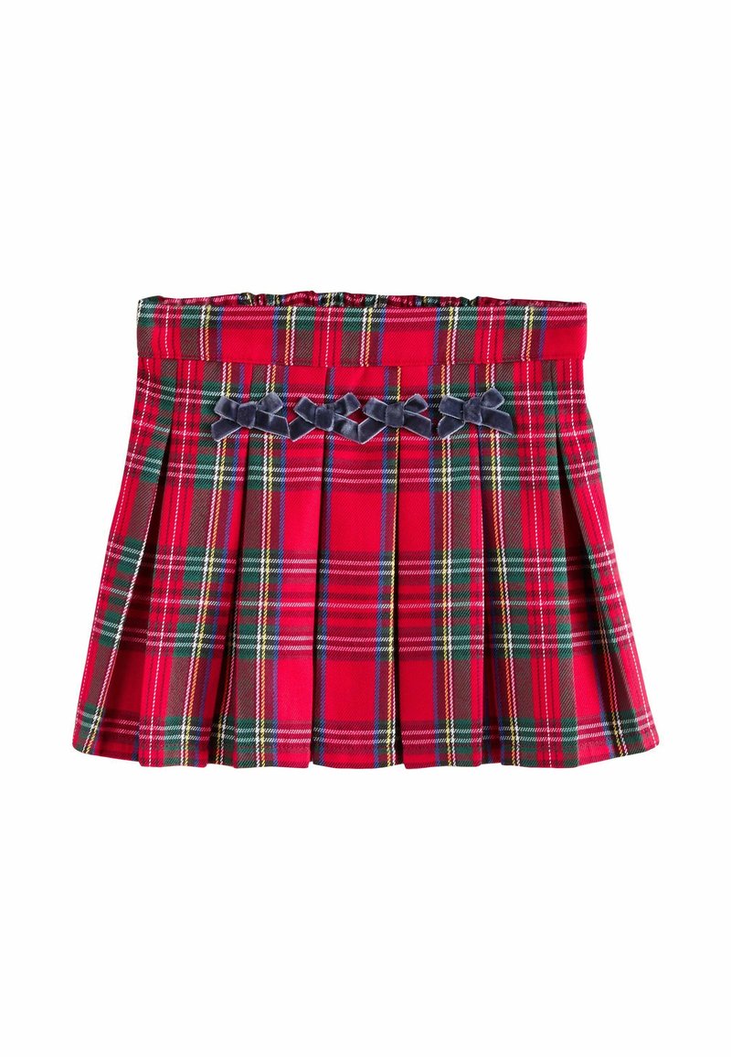 Rød tartan plisseret nederdel med grønne og gule striber. Har en flad talje og dekorative navyvelour-sløjfer på forsiden.