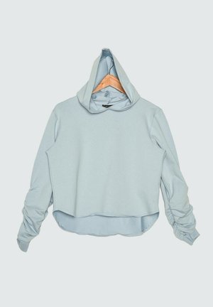 Cropped hoodie azzurro chiaro realizzato in morbido tessuto, con cappuccio, maniche lunghe con dettagli arricciati e orlo arrotondato.