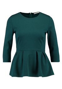 Teal peplum top met een ronde halslijn, driekwart mouwen en een rits aan de achterkant. Gemaakt van een soepele, rekbare stof.