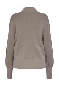 Pull en beige tricot à ourlet et poignets côtelés, avec un col haut et des manches bouffantes, texture lisse et coupe décontractée.