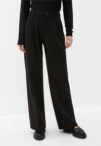 Black wide-leg trousers featuring a high waist, front pleats, and a single button closure. Smooth texture and minimalistic design.