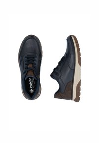 Zapatos de cuero azul oscuro con diseño de cordones y cierre de cremallera, que presentan acentos marrones y una suela de goma de color claro.