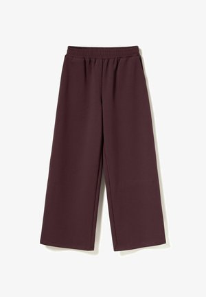 Löysät housut syvän burgundin värissä, valmistettu pehmeästä kankaasta. Varustettu joustavalla vyöllä ja suoran leikkauksen lahkeilla, joissa on taitetut reunat.