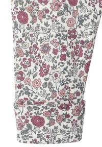 Blumenleggings mit einem weißen Grund und einem dichten Muster aus mehrfarbigen Blumen in Pink, Rot und Grün, mit einem umgeschlagenen Saumdesign.