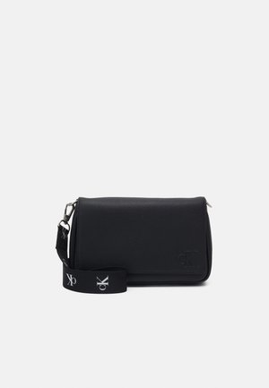Black rectangular crossbody bag with a flap closure, embossed "cK" logo, and a detachable strap featuring "cK" branding in white.