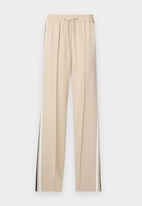 Beige wijde broek met een elastische tailleband en trekkoord, voorzien van zwart-witte zijstreep op elke pijp. Glad stoftextuur.