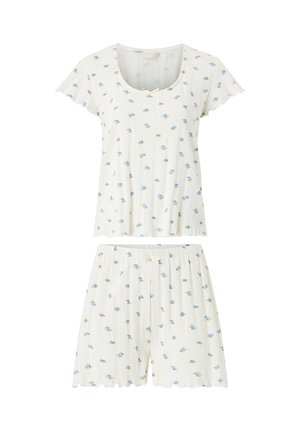 Witte geribbelde top met korte mouwen en short met koord, met kleine blauwe bloemenprint en geschulpte randen.