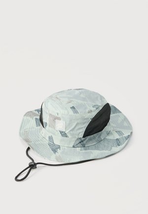 Light gray camouflage bucket hat with black mesh ventilation panels and adjustable chin strap on white background.