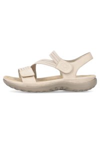 Sandalias beige con correas texturizadas, cierre ajustable de gancho y bucle, plantilla acolchada y suela de goma flexible para mayor comodidad.