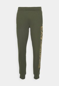 Olivově zelené zúžené tepláky s elastickým pasem a manžetami, se svislým žlutým logem EA7 Emporio Armani na levé nohavici.