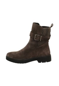 Stivaletti alla caviglia in camoscio marrone con punta arrotondata, una fibbia intorno al gambale e un colletto morbido e testurizzato. Suola spessa in gomma nera per una buona aderenza.