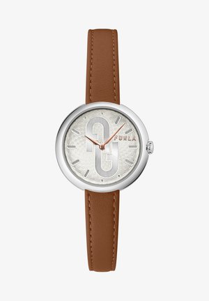 Sidabrinės spalvos laikrodis su tekstūruotu apvaliu ciferblatu, ant kurio yra logotipas ir ploni valandų žymekliai. Rėžiai turi rudą odinį dirželį su automatinėmis siuvimo detalėmis.