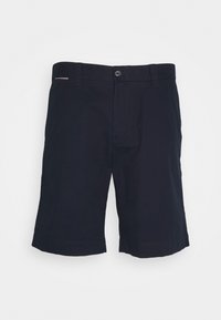 Pantaloni corti blu realizzati in cotone. Presentano una parte anteriore piatta, due tasche laterali e orli arrotolati. Design semplice con dettagli di cucitura minimi.