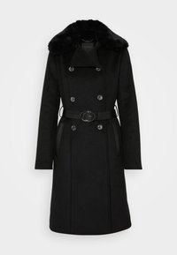 Zwarte dubbelgeknoopte wollen jas met nepbont kraag, gecincte taille met ronde gesp en zijzakken.