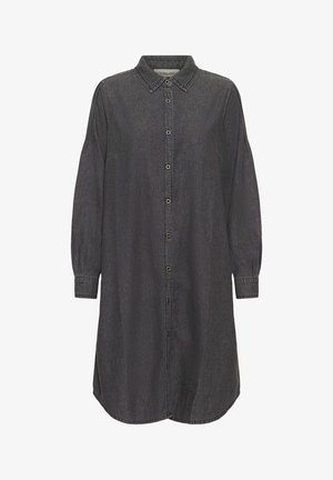 Musta farkkutunika, jossa on nappiknaavitus edessä, kaulus, pitkät hihat ja hieman kaareva helma. Ominaisuuksina on erottuva ommel ja napit.