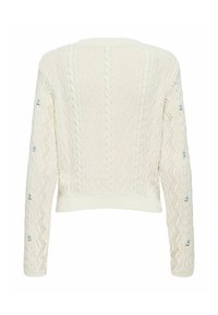 Pull en maille crème avec motifs torsadés et petite broderie florale bleue le long des manches, vu de dos.