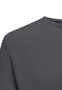 Grijze gestructureerde sweatshirt met een ronde hals. De stof heeft een subtiel visgraatpatroon, wat zorgt voor een ademende en casual uitstraling.