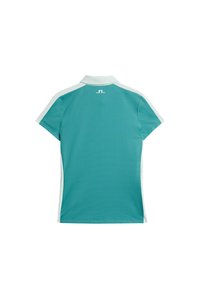 Teal kortärmad pikétröja med strukturerad yta, vita sidopaneler och krage. Har en liten logo på baksidan.
