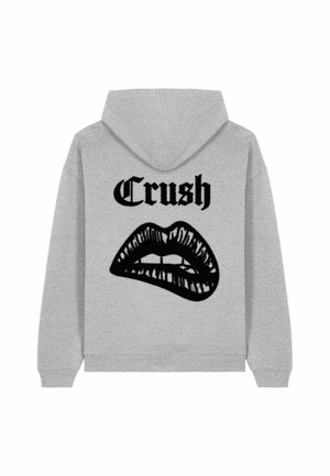 Sweat à capuche gris avec un grand graphique noir de lèvres et le mot "Crush" en gras noir au dos. Matériau en mélange de coton.