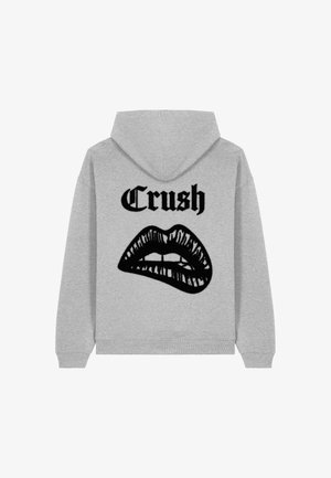 Szürke kapucnis pulóver, amelyen a hátsó részén egy nagy fekete szájgrafika és a "Crush" felirat látható, vastag fekete betűkkel. Pamut keverék anyag.