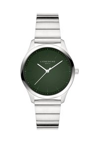 Grüne Zifferblatt-Uhr mit Gehäuse und Armband aus silbernem Edelstahl. Verfügt über minimalistische Stundenmarkierungen, Logo und drei Zeiger zur Zeitanzeige.