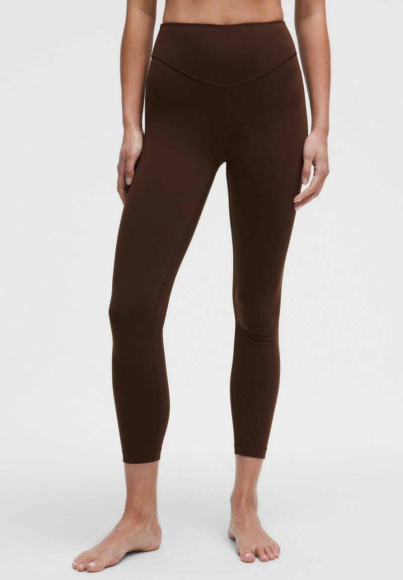 Brown, high-waisted leggings van gladde, rekbare stof. Strakke pasvorm met een naadloze uitstraling en een enkellange snit.