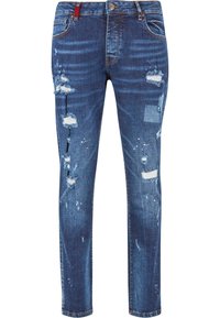 Jeans de mezclilla azul con un ajusteSlim, que presentan parches desgastados, bordes desflecados y un ligero desgaste. Cierre con botón de metal y cremallera.