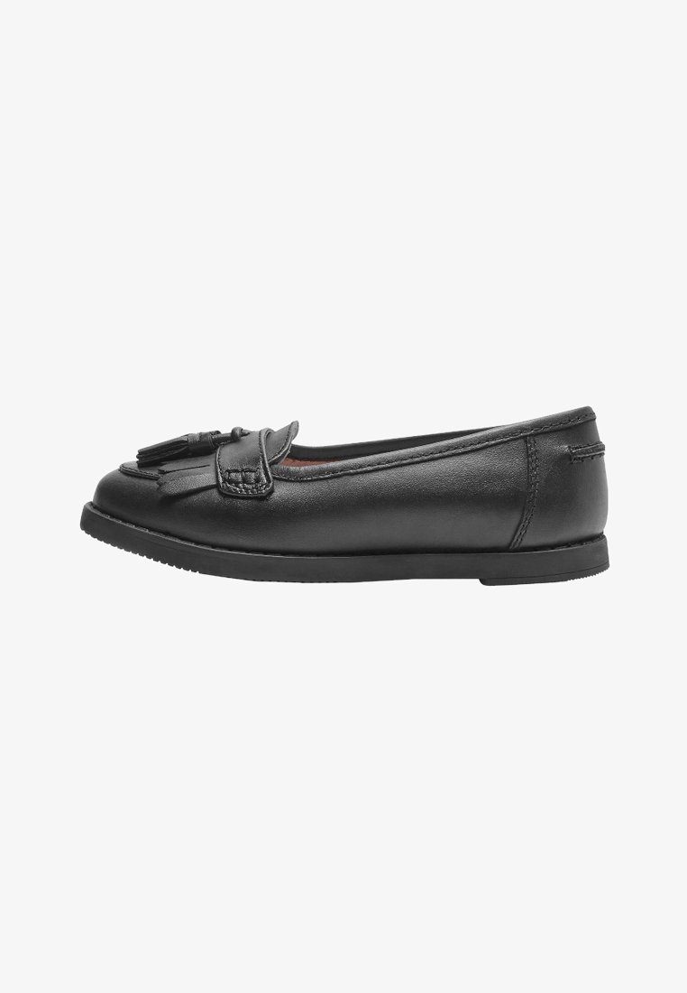 Black leather loafer with a low profile, featuring a decorative tassel, smooth texture, and a rubber sole with a subtle tread pattern.
