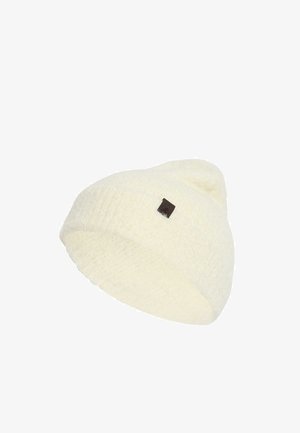 Gorro de punto color crema con un pequeño logo cuadrado negro en el lateral, presentado sobre un fondo blanco.