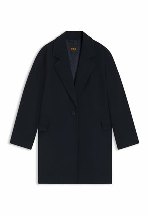 Cappotto in misto lana blu navy con chiusura a un bottone, revers, tasche a toppa e fodera interna trapuntata.