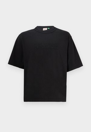 Black cotton T-shirt with a crew neckline and short sleeves. Features embossed "GUESS ORIGINALS" text on the front. Simple, relaxed fit.