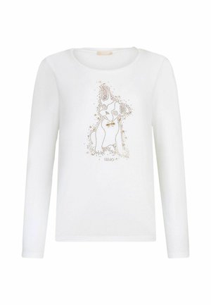 T-shirt bianco a maniche lunghe in cotone, con una stampa a forma di cane ricoperta di borchie dorate. Collo rotondo con una texture liscia.
