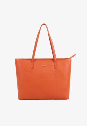Orange leather tote bag with two long handles, a small metal fish emblem on the front, and a zipper closure at the top.