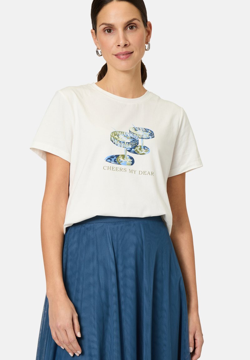 White cotton t-shirt with short sleeves, featuring a blue and green printed design of cocktail glasses and "CHEERS MY DEAR" text.