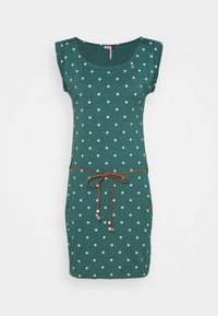 Robe sans manches verte avec des pois blancs, col rond, taille élastique réglable en cordon brun, et boutons décoratifs sur les côtés.