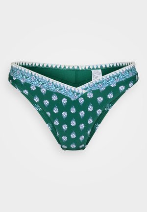 Zaļa bikini apakšdaļa ar ziedu rakstu baltā un gaiši zilā krāsā. Iezīmējas ar V formas jostas vietu ar viļņotu apdari. Izgatavota no mīksta, elastīga auduma.