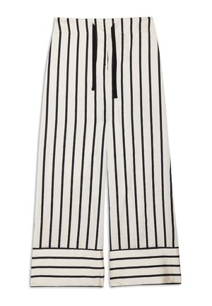 Pantalon blanc à jambes larges avec des rayures verticales noires et une taille à cordon noir, agrémenté de rayures horizontales aux poignets.