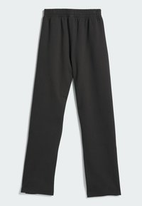 Zwarte sweatpants van zacht, rekbaar materiaal. Beschikt over een elastische tailleband met geplooide details en een recht gesneden ontwerp.