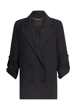 Blazer negro de doble botonadura con un diseño estructurado, solapas con muesca, mangas remangadas y una tela suave y texturizada.