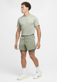 Nike Performance Sportiniai šortai - jade horizon