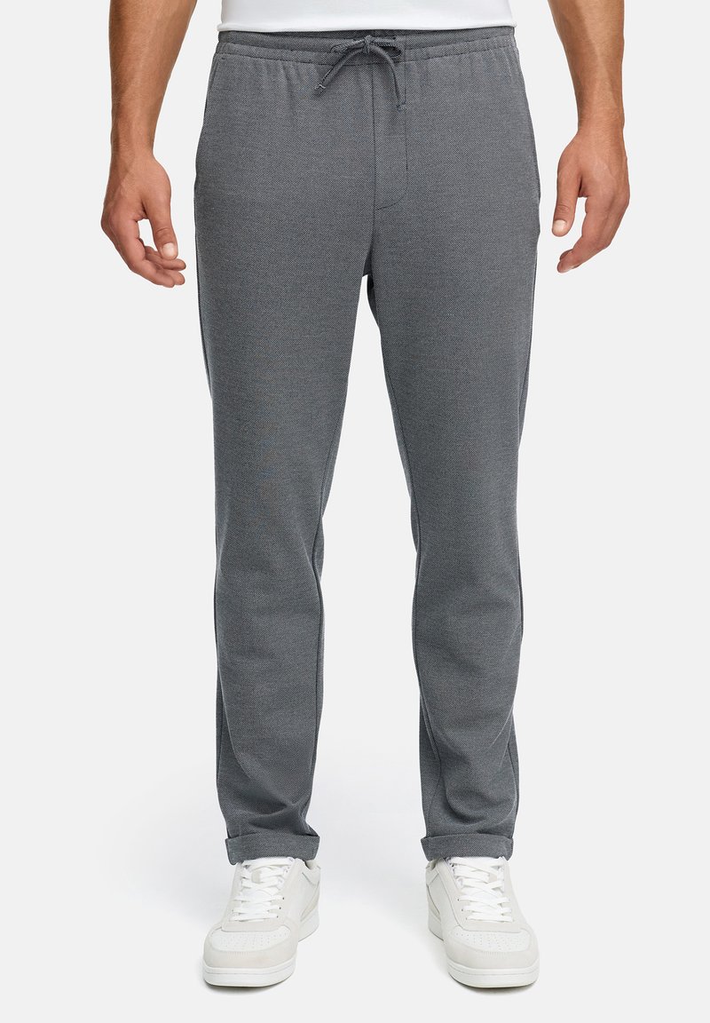 Graue Jogger-Hosen aus weichem Stoff, mit elastischem Bund und Kordelzug, schmal zulaufenden Beinen und minimalen Nähten.