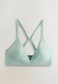 Bralette côtelé vert clair avec fines bretelles réglables croisées dans le dos et bande élastique de marque en bas.