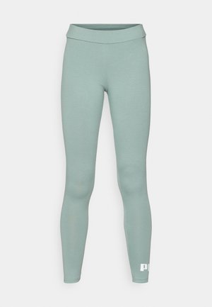Leggings atletice verzi deschise, cu o textură netedă, talie înaltă și detalii cu logo alb la gleznă. Design fără cusături pentru confort.